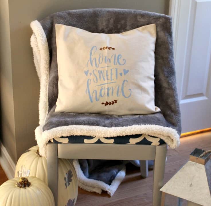 Learn how to make a beautiful double-sided stenciled pillow for your home! The best part about this tutorial...it's an easy no sew DIY that uses pillow covers! Perfect for living rooms or bedrooms! #diypillow #homedecor #kenarry