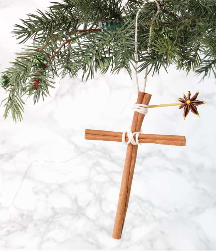 Find out how to make these beautiful homemade Christmas ornaments for your Christmas tree! These easy ornaments are made from cinnamon stick crosses with an anise star and smell totally amazing. It's a fun Christmas craft for kids to do! #christmas #christmascrafts #kenarry