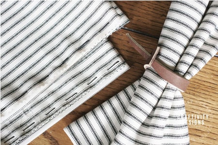 leather napkin rings, ticking stripe cloth napkins
