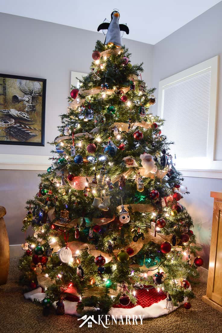 Love farmhouse style decor? Learn how to decorate a rustic Christmas tree like a professional this holiday season with ornaments, lights, and wide burlap ribbon as garland using these step by step instructions. #christmastree #christmas #kenarry