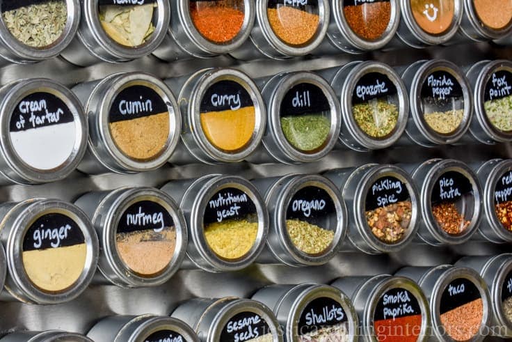 Spices taking over your kitchen? Make this easy DIY giant magnetic spice rack. It holds 36 different spices, and it could hold more if you want it to!