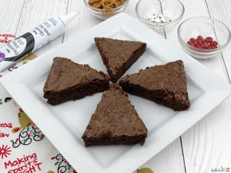 Cut cooled brownies into triangles to make reindeer brownies