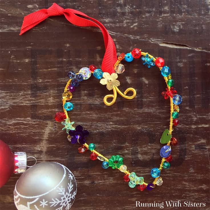 Learn to make DIY Colorful Beaded Christmas Ornaments using floral wire, beads, and sequins. We'll show you every step with this homemade holiday craft video tutorial! #christmascrafts #christmas #kenarry