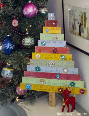 Make your own Vintage Yardstick Christmas Tree from rulers and yardsticks. Just cut the yardsticks to make the tree and add brooches as ornaments.