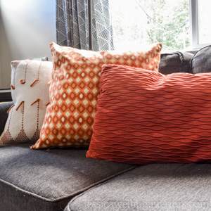 Sew your own super-easy throw pillow covers to save space and money! This step-by-step tutorial will show you how.