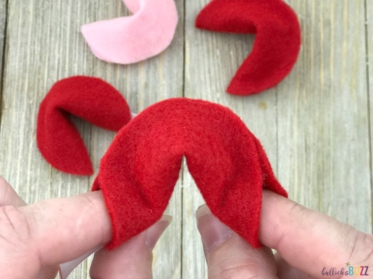 DIY Valentine's Day Fortune Cookie bend two side of half circle back towards eachother to make cookie shape