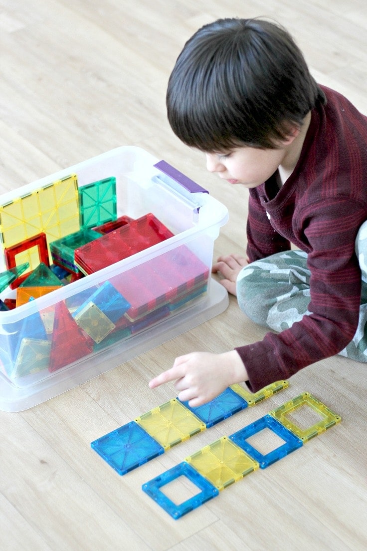 Learn how to teach pattern recognition by playing fun preschool pattern games and activities with magnetic tiles! Pattern recognition is an important early math skill which allows children to replicate patterns while improving fine motor skills, which makes this a great STEM activity. #montessori #preschoolers #kenarry