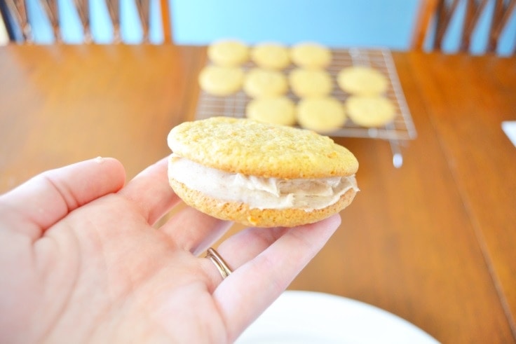How to make carrot cake cookie sandwiches with cinnamon cream cheese frosting.