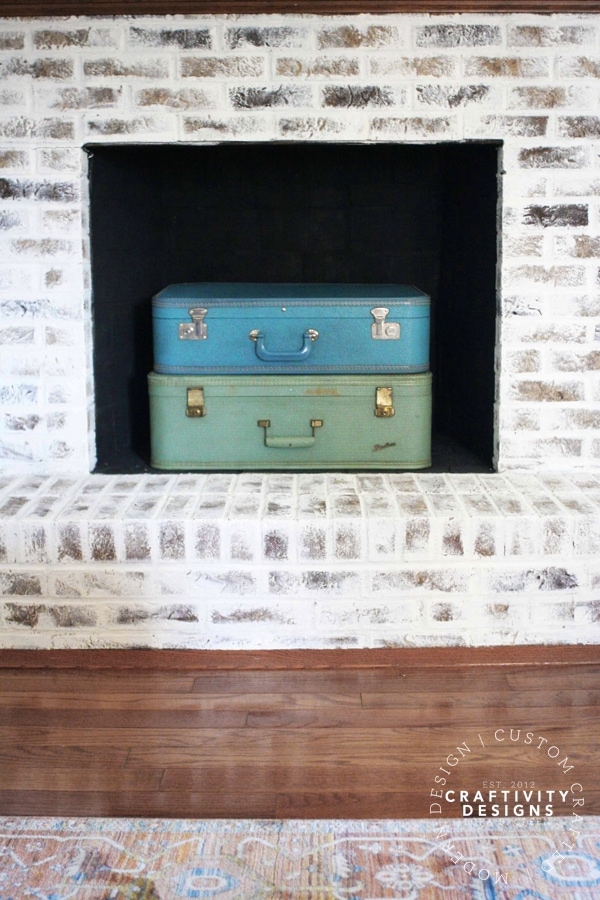 3 Non-Working Fireplace Ideas, Suitcase stacked in a Firebox, by Craftivity Designs