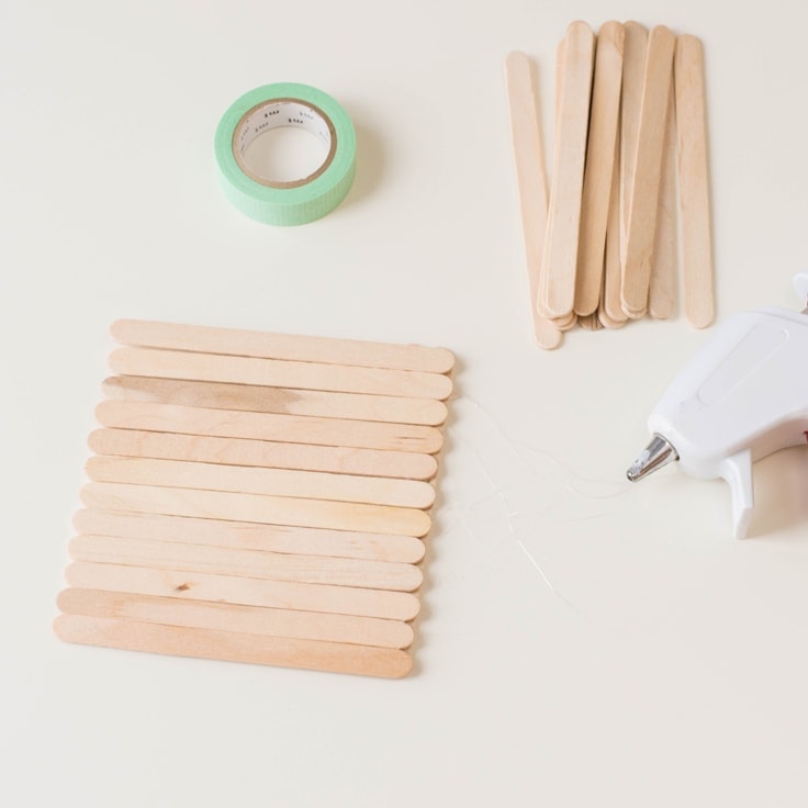How to make a popsicle stick craft. Third step is to glue sticks side by side. 