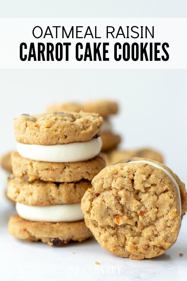 Title on Image: Oatmeal Raisin Carrot Cake Cookies. An oatmeal raisin carrot cookies is standing vertically on end so you can see the chunks of minced shredded carrot. Next to it there are two carrot cake cookies stacked on top of one another in the background.