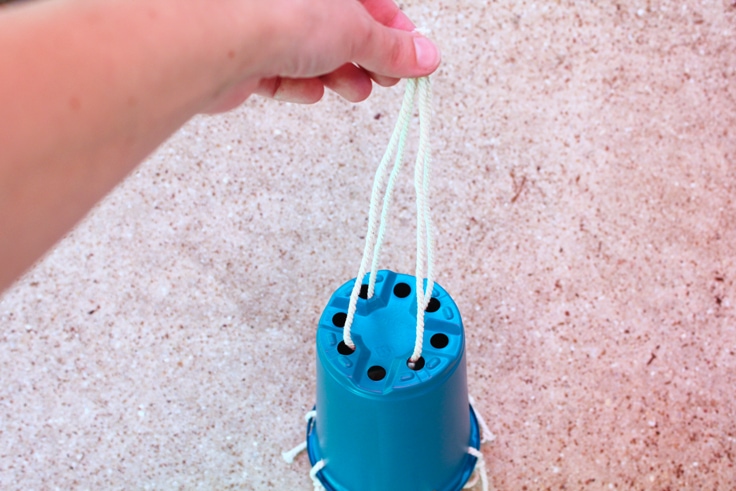 A blue container with string coming out of the top