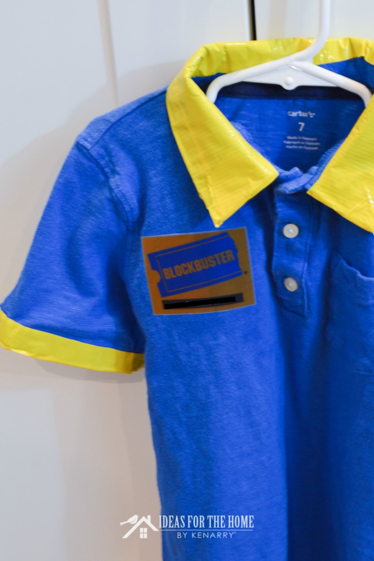 A close up of a name tag on a DIY Blockbuster video shirt for a Halloween costume