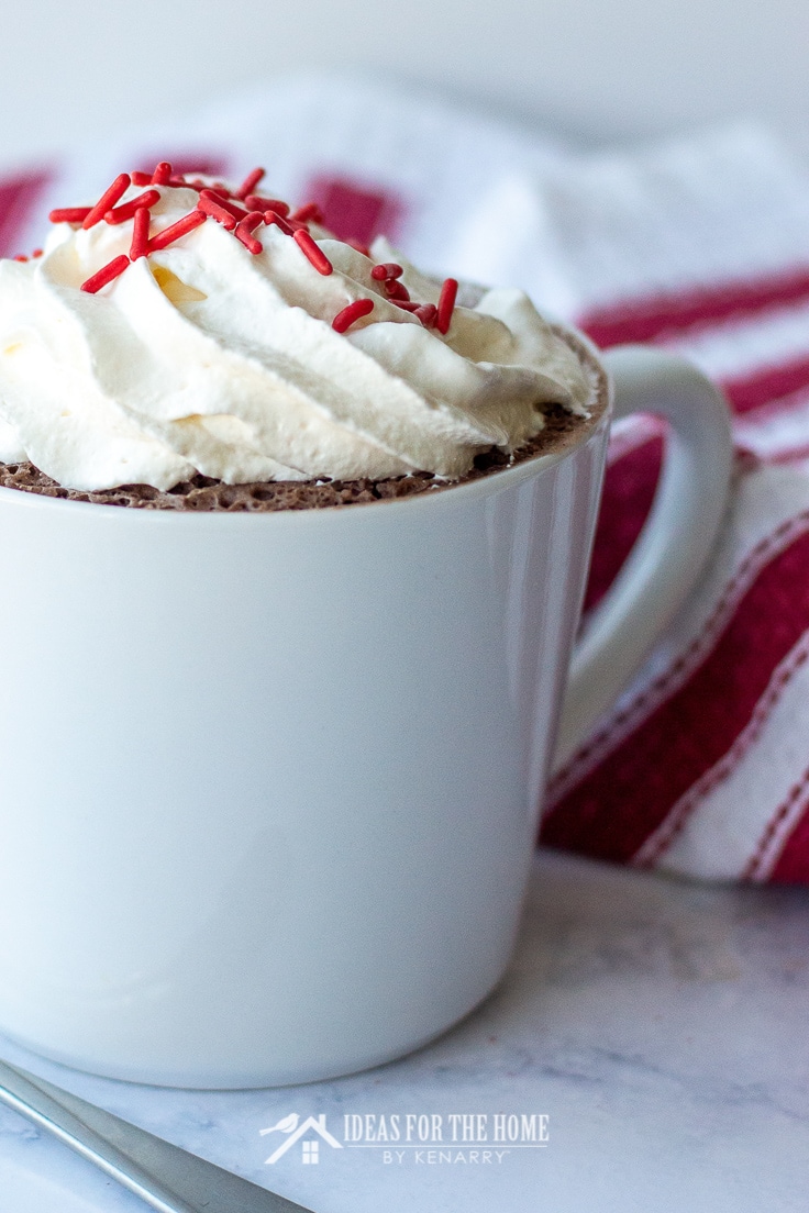 Close up of whip cream with sprinkles on a 3 2 1 mug cake