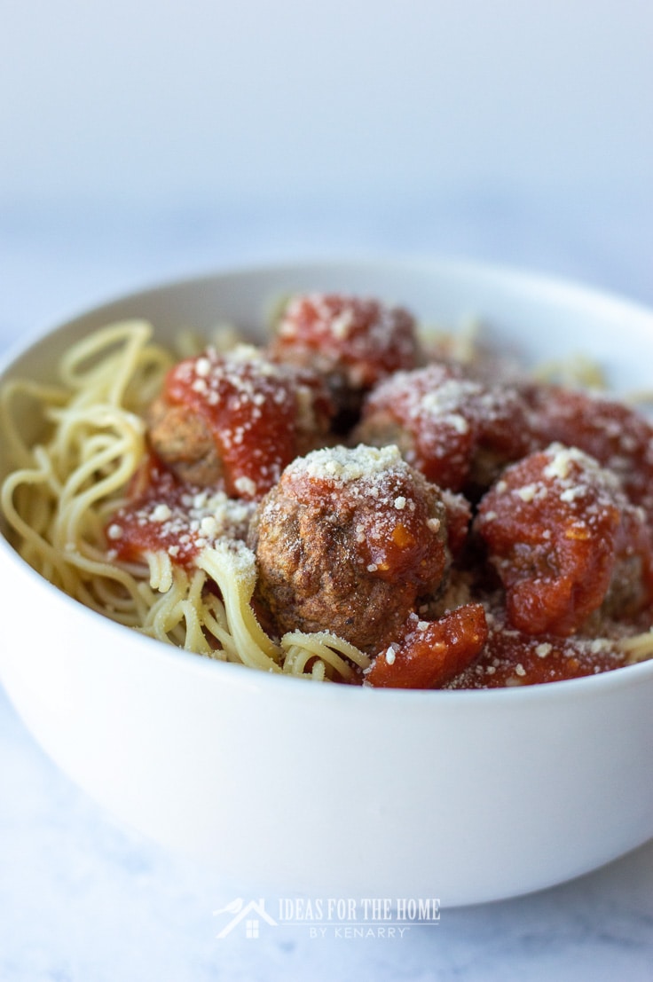 Side view of meatballs in a bowl of spaghetti