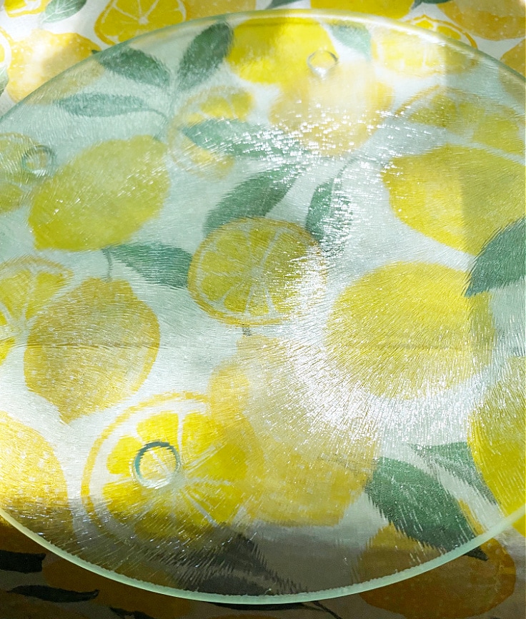 Lemon napkins on glass cutting board.
