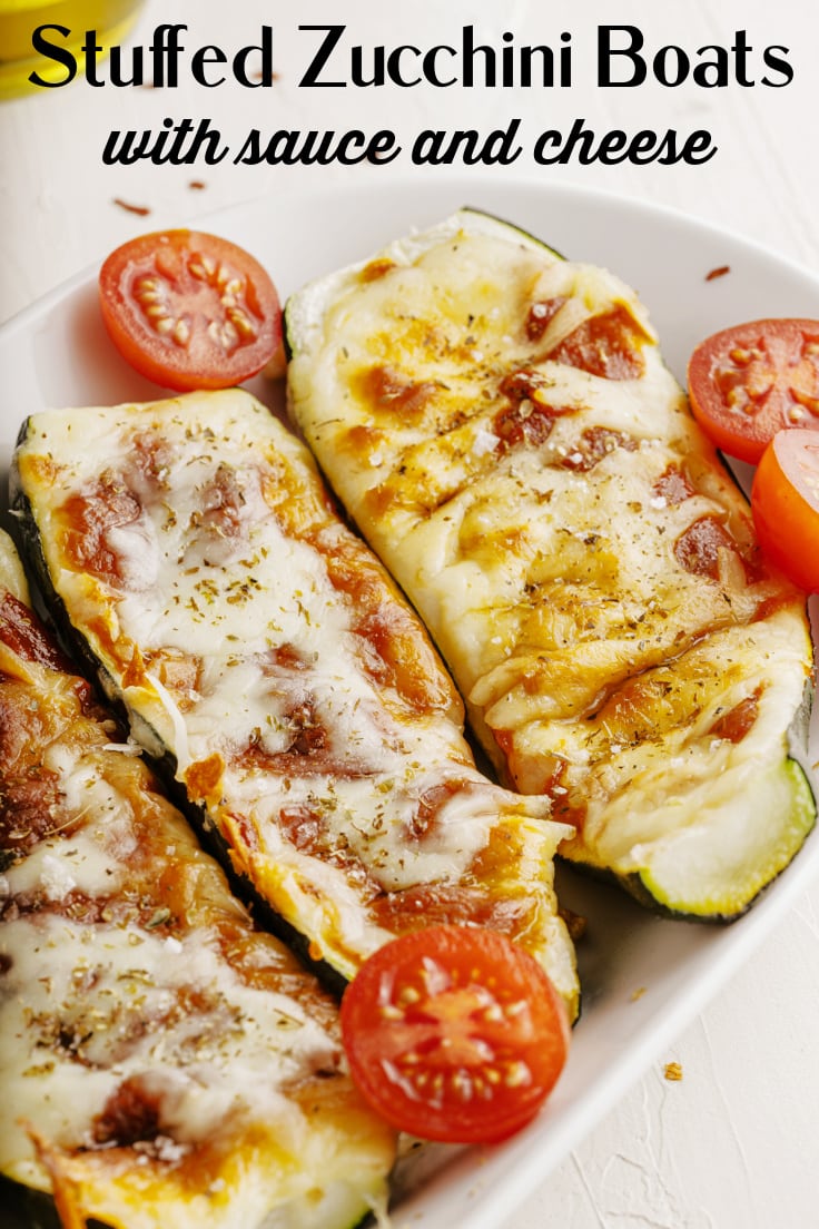 Stuffed zucchini boats with sauce and cheese.