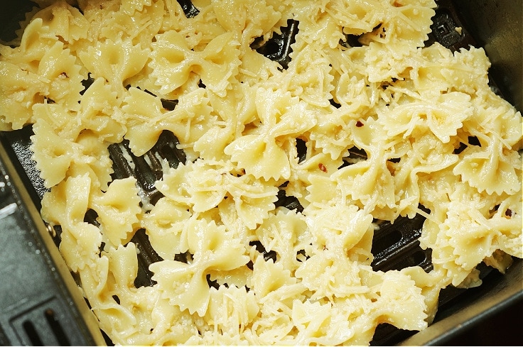 Cooked white bowtie pasta.